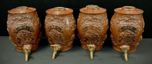 A set of four Brampton stoneware spirit barrels, each relief sprigged with Knights and Lion, grape