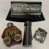 A mid 20th century German Gesch/Baier novelty table lighter, the hexagonal red body with remnants of