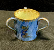 A Wedgwood Dragon lustre miniature three-handled loving cup/Tyg, designed by Daisy Makeig-Jones,