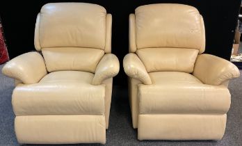 A pair of Sherborne electric recliner armchairs, in cream ‘leather’ upholstery, (2).