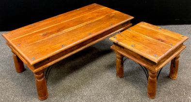 An exotic hardwood and metalwork coffee table, rectangular top, turned legs with decorative ‘forged’