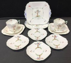 A Shelley ‘Crabtree’ part tea service comprised of; a pair of picnic plates, two tea cups,