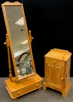 A pine cheval mirror, single drawer to base, 163cm high x 61cm wide x 36cm deep; a pine bedside