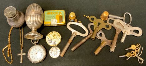 A silver pepper; a silver fob watch; a Decca gramophone needle tin; clock keys; etc