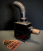 A Gloria E.P Duplex burner magic lantern, conforming slides depicting Victorian cartoons, scenery;