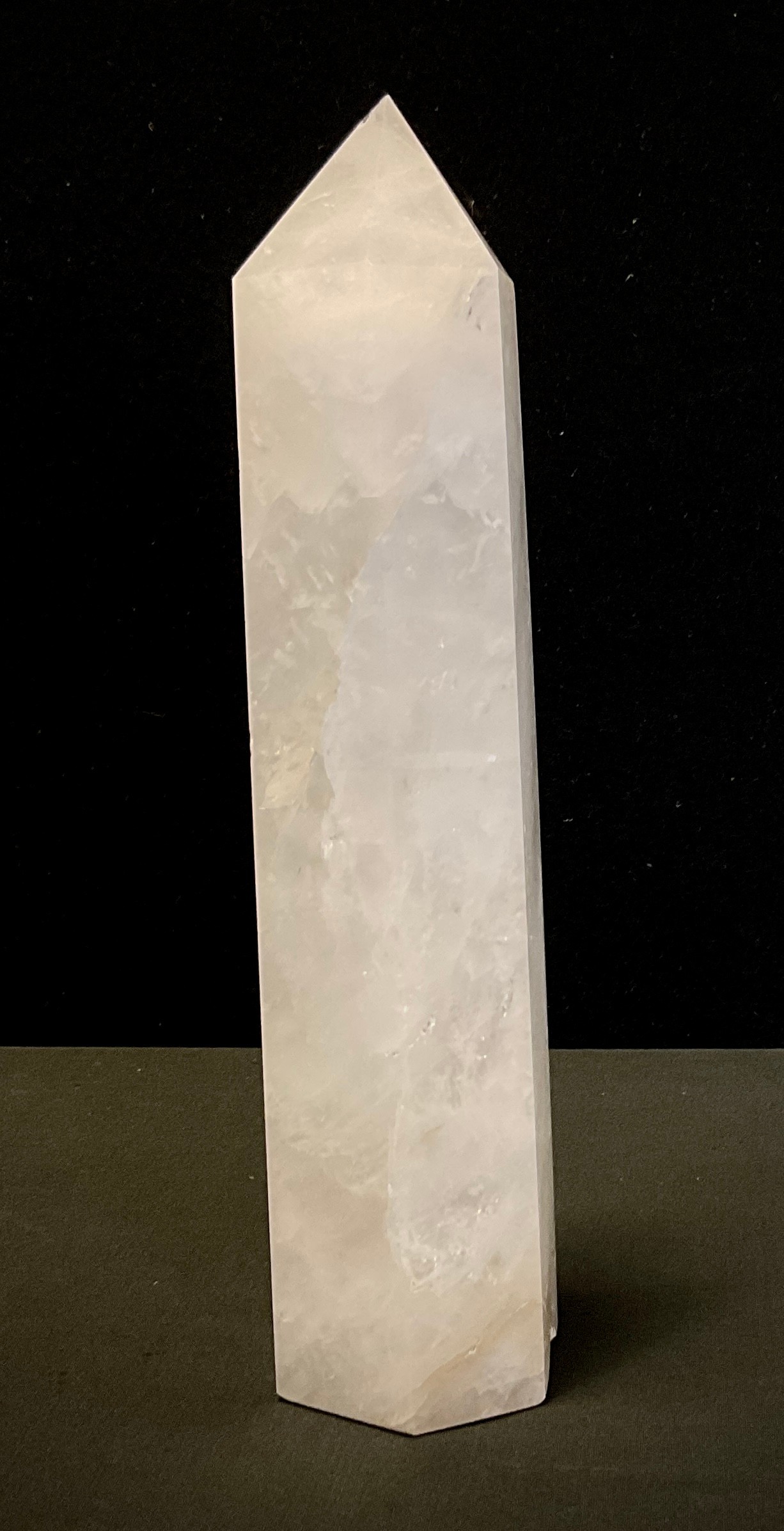 A Rock crystal white quartz obelisk of slightly tapering hexagonal form, 29cm high.
