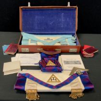 A 1970s Masonic case with aprons, sashes, books etc