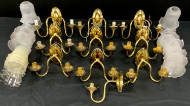 A set of six two branch brass light fixtures, four extra similar, conforming light shades, 16cm high