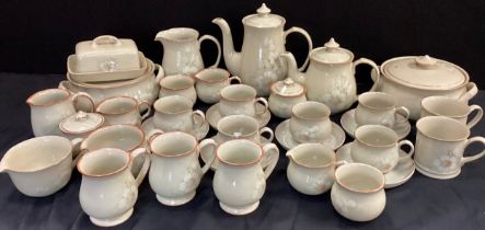 A Denby Daybreak pattern dinner and table service inc tureens, plates, cups, saucers etc