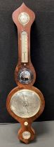 A 19th century mahogany wheel barometer, onion shaped shaped cresting, silvered resister hygrometer,