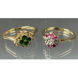 An emerald and diamond cluster ring, central cluster of four round cut emeralds surrounded by