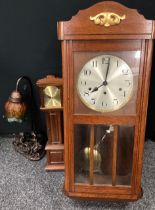An oak wall clock, chiming movement, silvered metal dial, Arabic numerals, 76.5cm high x 32.5cm