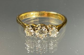 A diamond ring, linear set with three round old brilliant cut diamonds, estimated total diamond