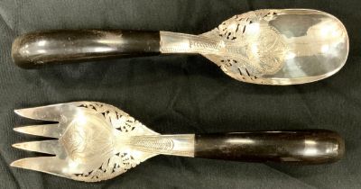 A dual set of Middle eastern serving spoons, horn handles, stamped silver, 30cm (2)