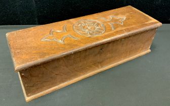 A late 19th century oak rectangular candle box, the hinged cover carved with a Yorkshire rose,