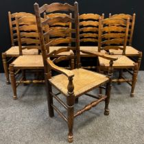 A set of six ladder-back 19th century style elm dining chairs, and a matching carver chair, rush