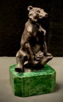 A Bronzed metal figure, seated Bear, malachite effect plinth, 16cm high.