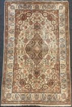 A Persian Kashan rug / carpet, wool and silk mix, knotted with Navette-shaped medallion, within a