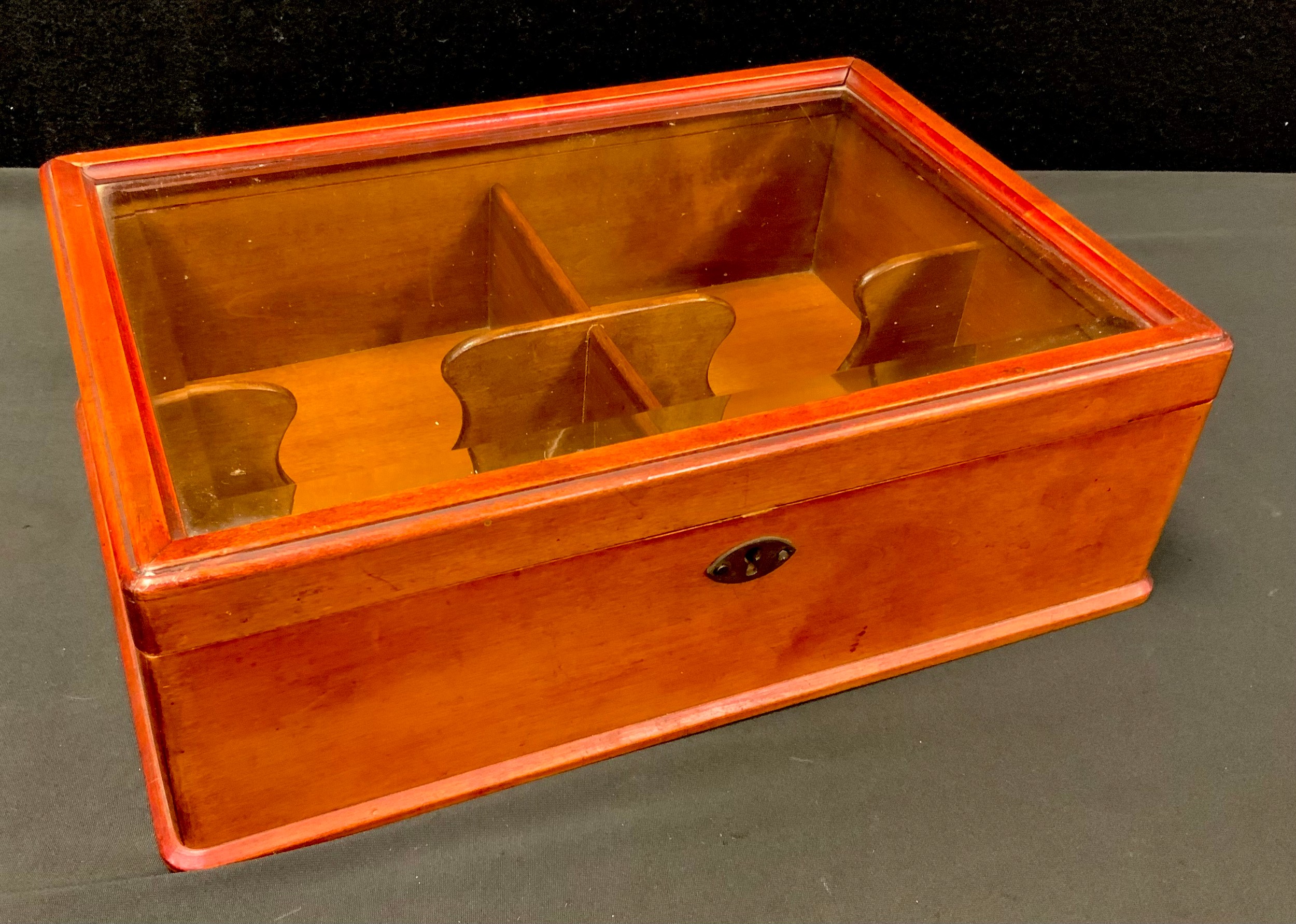 An early 20th century glazed four-section cigar box