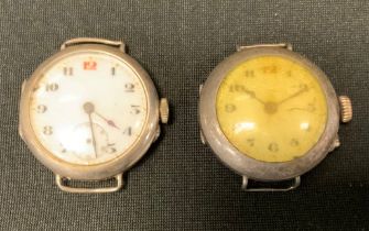 An early 20th century silver trench watch, import mark for London 1919; another, London 1915 (2)