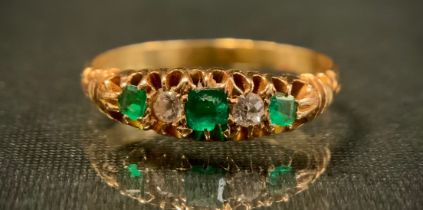 A diamond and emerald ring, set with three emerald and two diamonds in alternating crest, unmarked