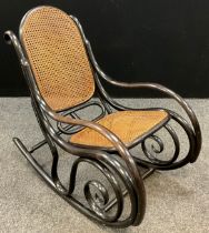 A mid 20th century Thonet, model number 10, bentwood rocking chair, Bergere weave to back and
