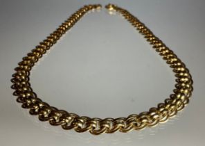 A fancy multi loop link yellow metal necklace, stamped 9k, 50cm long, 1.2cm wide, 26.7g