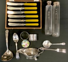 Sliver and plate including trefoil spoon, Sheffield goldsmiths, 1929, silver topped hat pin jars;