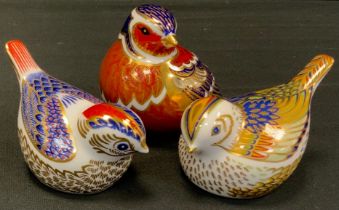 A group of three Royal Crown Derby paperweight birds including; Robin, silver stopper, Firecrest,