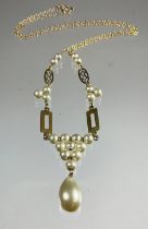 A fancy link yellow metal and seed pearl necklace, clasp stamped 9ct, 3.8g gross