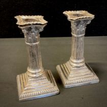 A pair of late Victorian silver Corinthian column candlesticks, weighted bases, 14.5cm high,