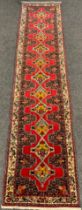 A North West Persian Senneh Runner carpet, 405cm x 85cm.