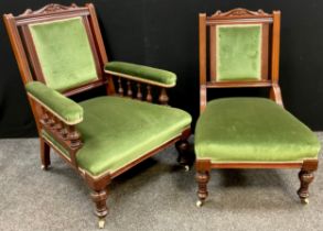 A Victorian walnut sitting room armchair, and a matching chair, carved top-rail, upholstered back,