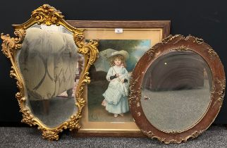 Mirrors including solid oak and gilt rococo oval mirror,60cm high, other similar, a 20th century