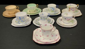 A collection of eight Shelley tea cups trios including ‘ Bluebells’ tea cup trio, pattern no.11767,