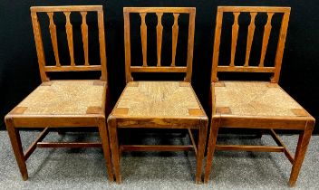 A set of three early 19th century Lathe back kitchen chairs, drop-in rush seats, c.1830 (3)