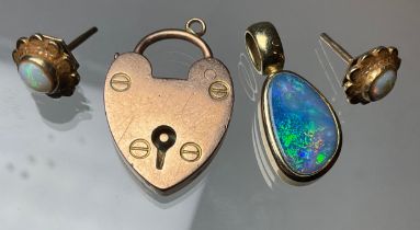 A 9ct gold black opal pendant, irregular opal with blue, green and violet colour, pair of white opal