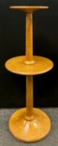 A hand crafted oak Ram furniture dumbwaiter lamp stand, circular top and shelf, plain turned