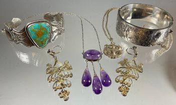 Jewellery - a turquoise silver mounted bangle, another hinge bangle, amethyst triple drop pendant