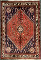 A South-west Persian Abadeh rug, hand-knotted with central medallion in dark blue, within a field of
