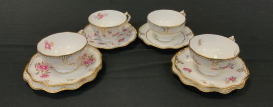 A group of Royal Crown Derby tea cups and saucers including two trios; Royal Pinxton Roses tea cup