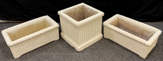 Garden statuary - a square reconstituted stone planter, in the classical style with fluted sides,