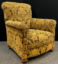 An early 20th century oak framed armchair, re-upholstered, 94cm high x 84cm wide x 78cm deep.