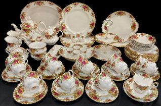 A Royal Albert ‘Old Country House roses’ part table service for eight including; four dinner plates,
