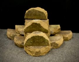 Derbyshire gritstone coping stones, 17 in total, each approx. 14cm x 32cm x 11cm.