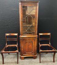 A mahogany corner cabinet by Reprodux Furniture, dentil cornice, astral-glazed door to top,