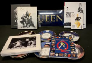 A collection of Queen memorabilia including - Freddie Mercury ‘The Great Pretender’ a life in