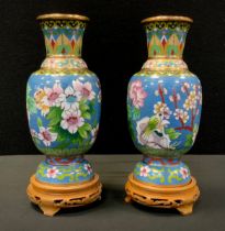 A Pair of Japanese cloisonné vases, decorated with birds and flowers, blue ground, carved wooden