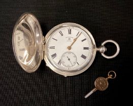 A George V silver hunter cased military pocket watch, Rotherham's London, white enamel dial, bold
