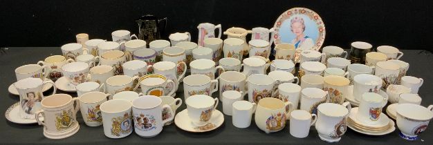 A collection of Commemorative cups and beakers including; a beaker celebrating the Coronation of